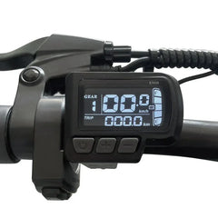Digital display on a bicycle handlebar with gear and speed information.