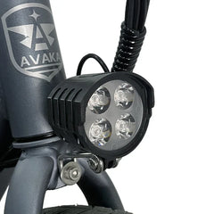 Bicycle light with Avaka branding on a white background