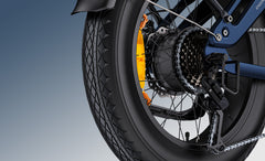 Close-up of a Engwe Engine Pro 3.0 Boost Folding Electric motorcycle wheel with chain and sprocket on a gradient background