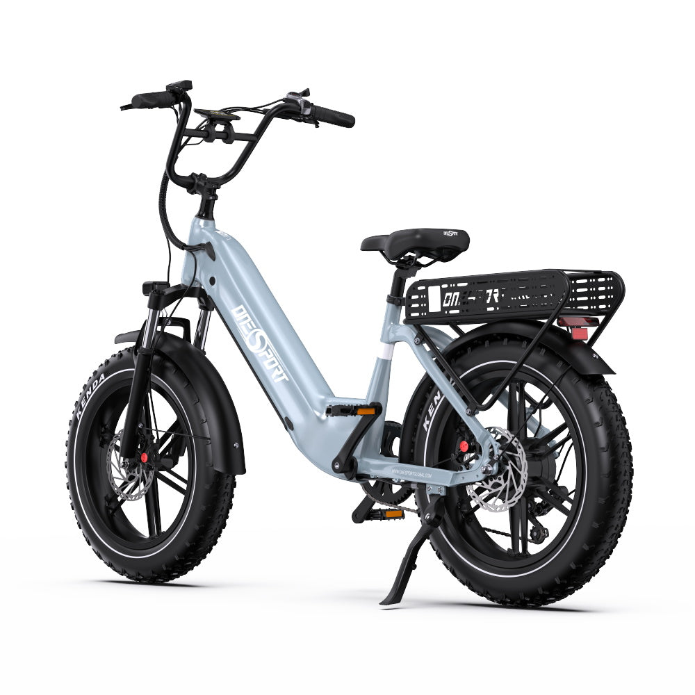 A light blue Onesport OT08 electric fat-tire bicycle with black components, a rear cargo basket, and a kickstand, photographed on a clean white background.