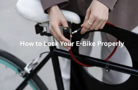 Person securing electric bike with red lock, Pogo Cycles e-bike safety guide.