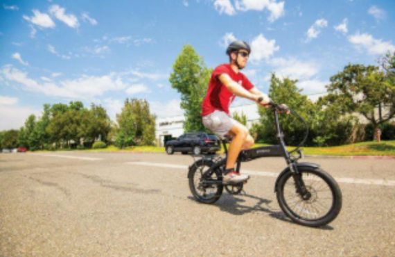 Man riding electric bike outdoors on sunny day, Pogo Cycles e-bike store promotion