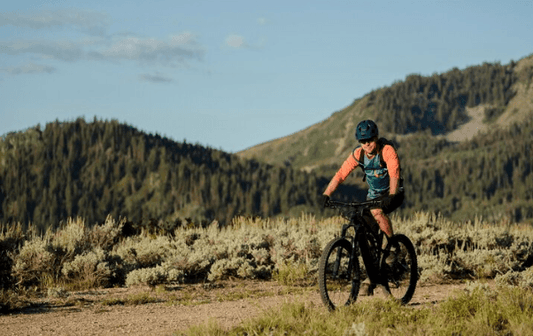 Electric mountain bike ridden on a gravel trail in a scenic outdoor landscape