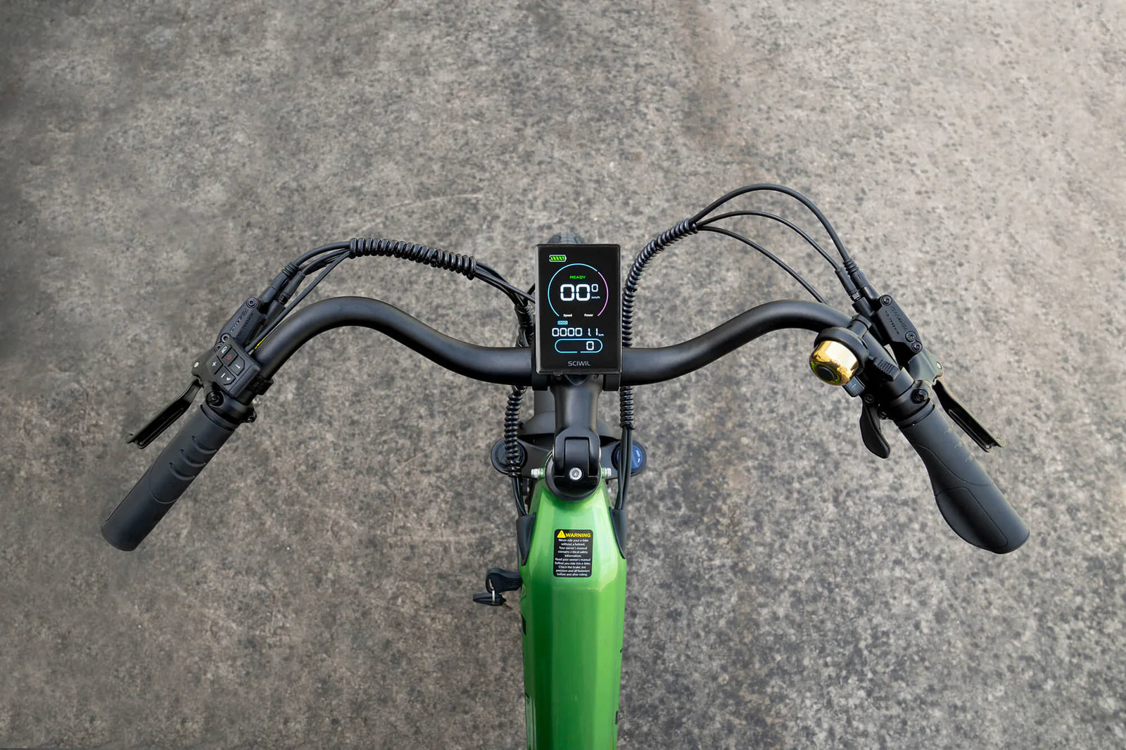 Close-up of a Cyrusher Sprint Electric City Bike in green handlebar with a digital display on a gray pavement background
